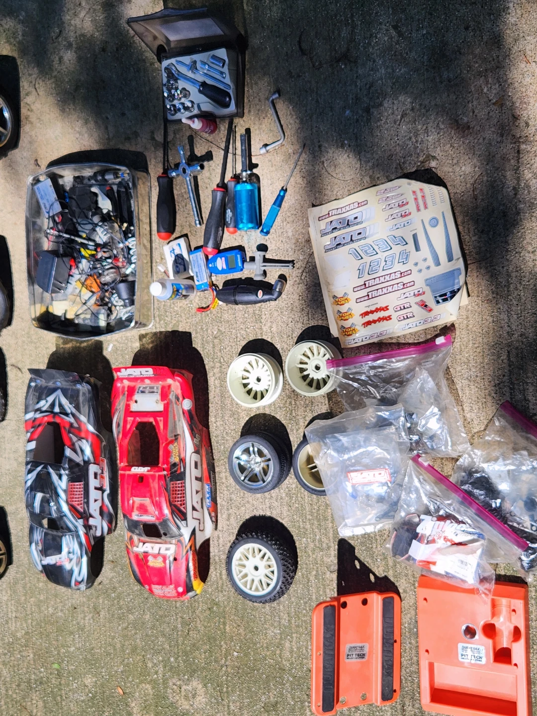 Traxxas Jato RC Car Lot with Parts and Remotes - photo 3