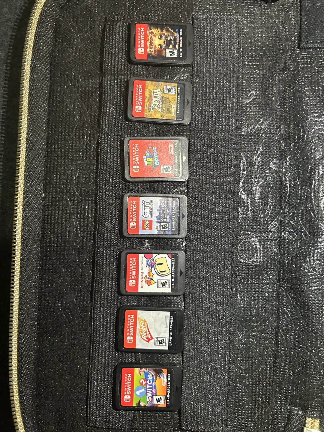 2 Nintendo Switches, 7 games, and case with controllers. - photo 5