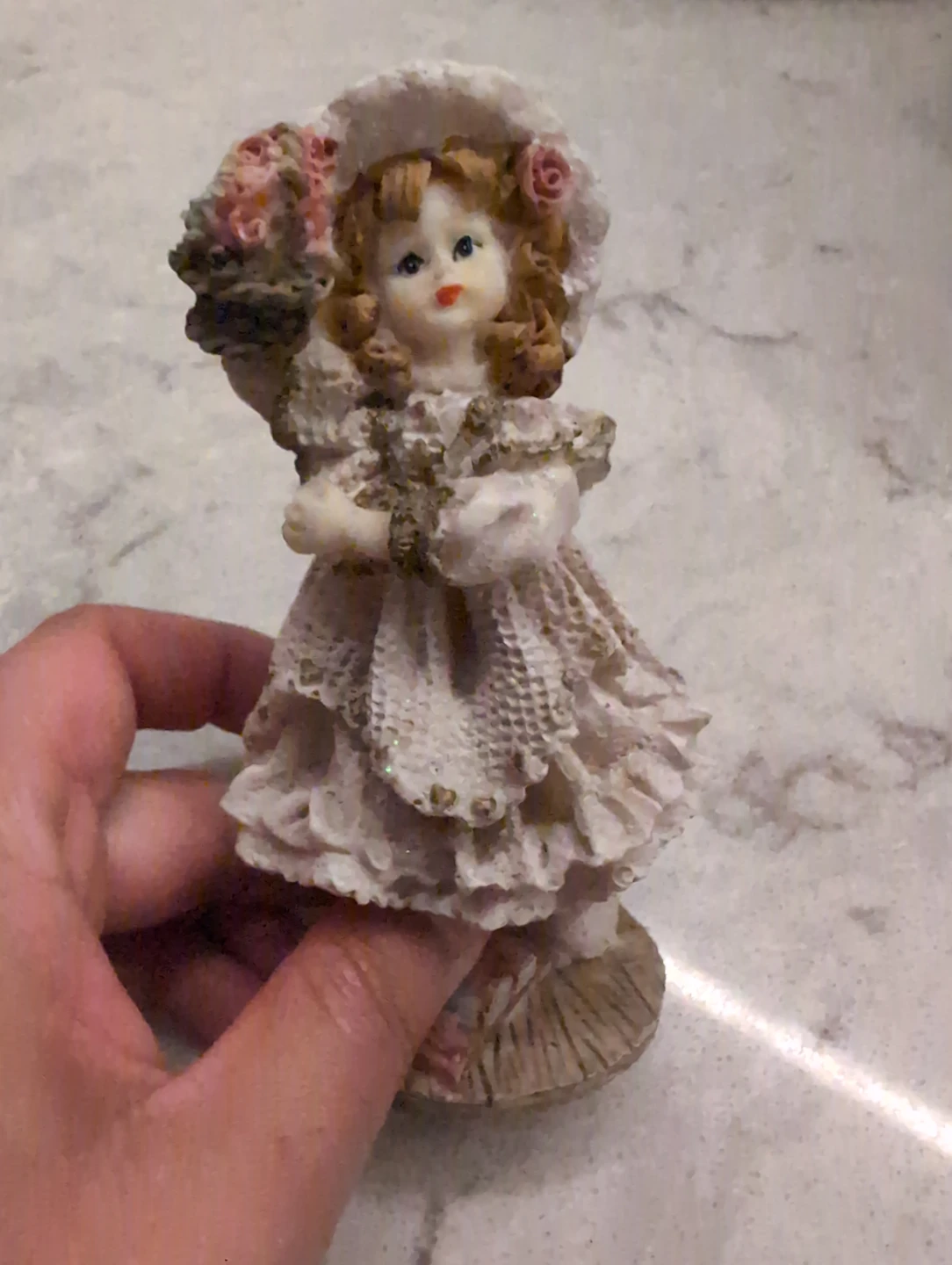 Decorative Figurine of a Girl Holding Flowers