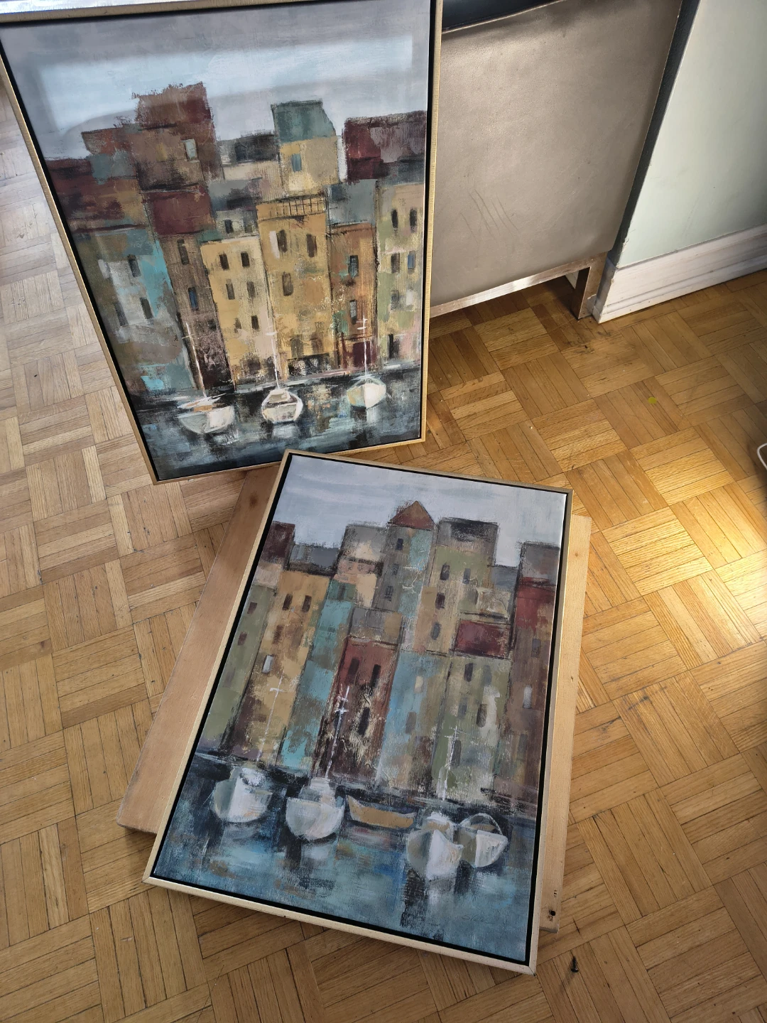 Painting of a European coastal town with boats