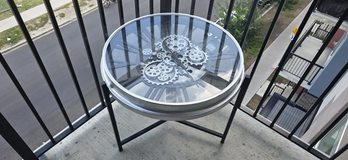 Glass table with a functioning clock