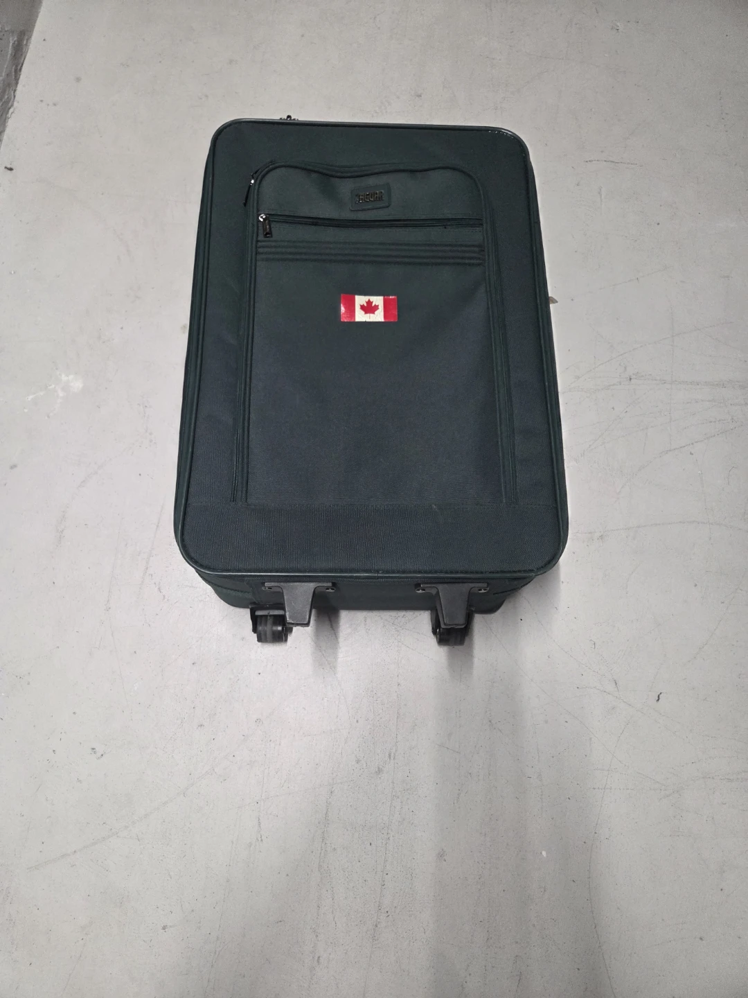 Jaguar Dark Green Spinner Suitcase with Canadian Flag Decal
