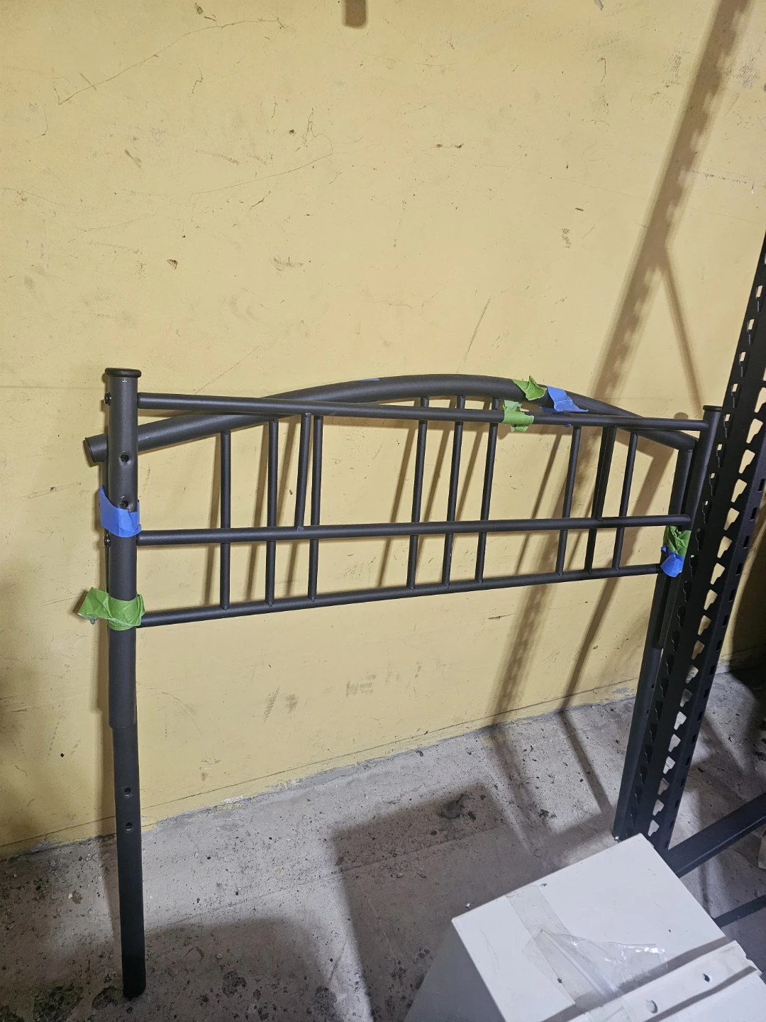 Black metal bed frame with headboard