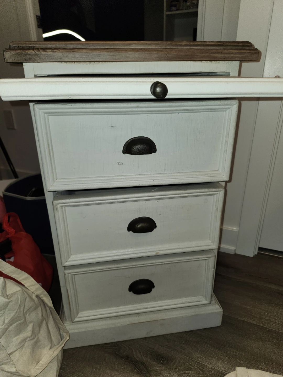 White three drawer nightstand with wooden top