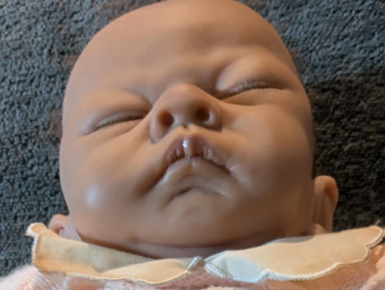 Realistic sleeping baby doll in pink knit outfit - photo 2