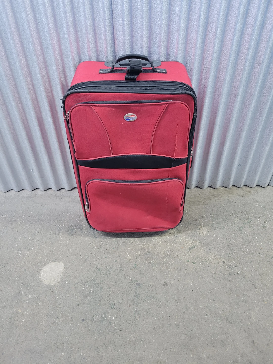 American Tourister Red Rolling Suitcase