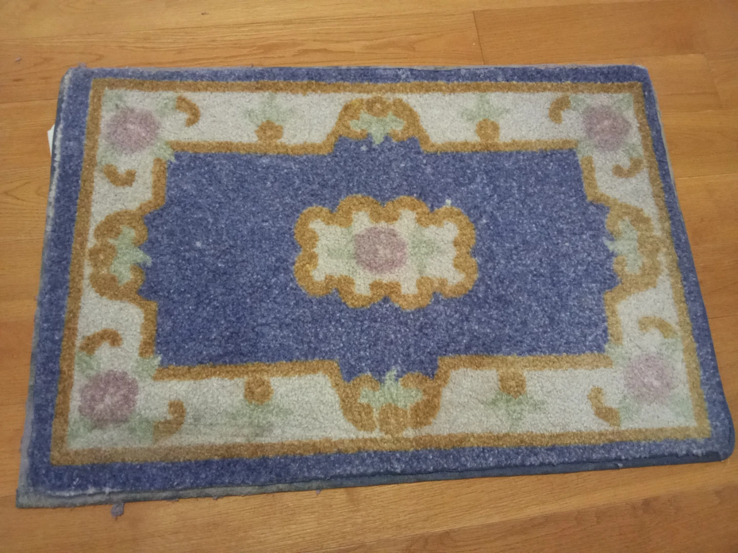 Blue floral patterned rug