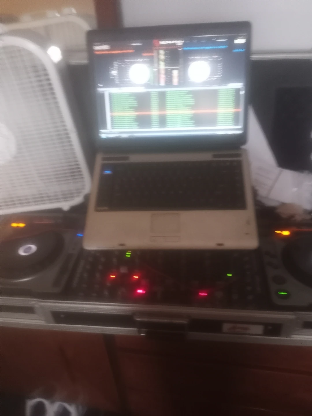 DJ Equipment Setup with Laptop and Controller
