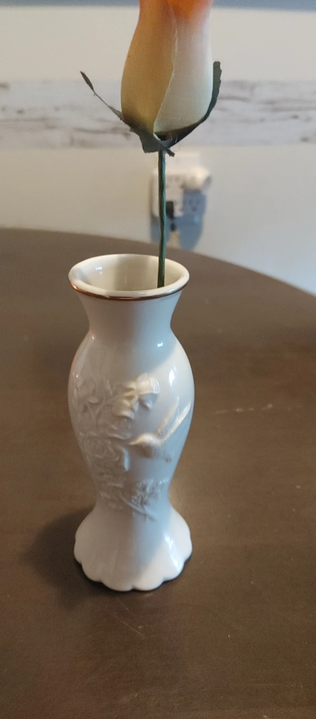White porcelain bud vase with embossed floral design