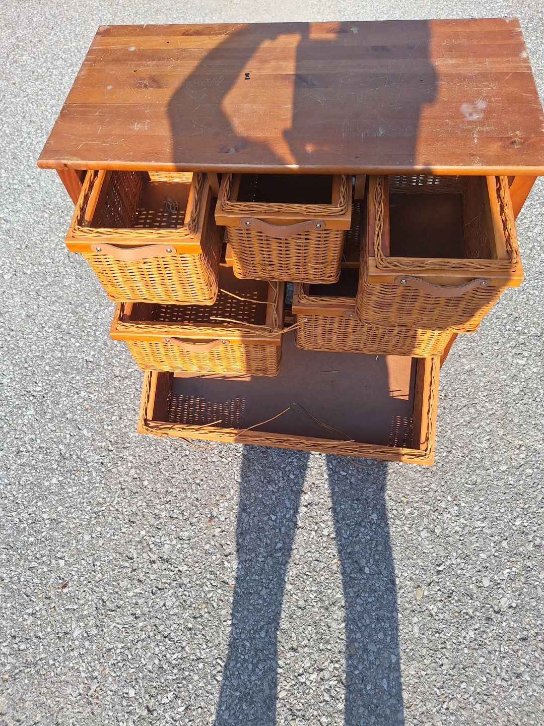 Wooden dresser with wicker baskets