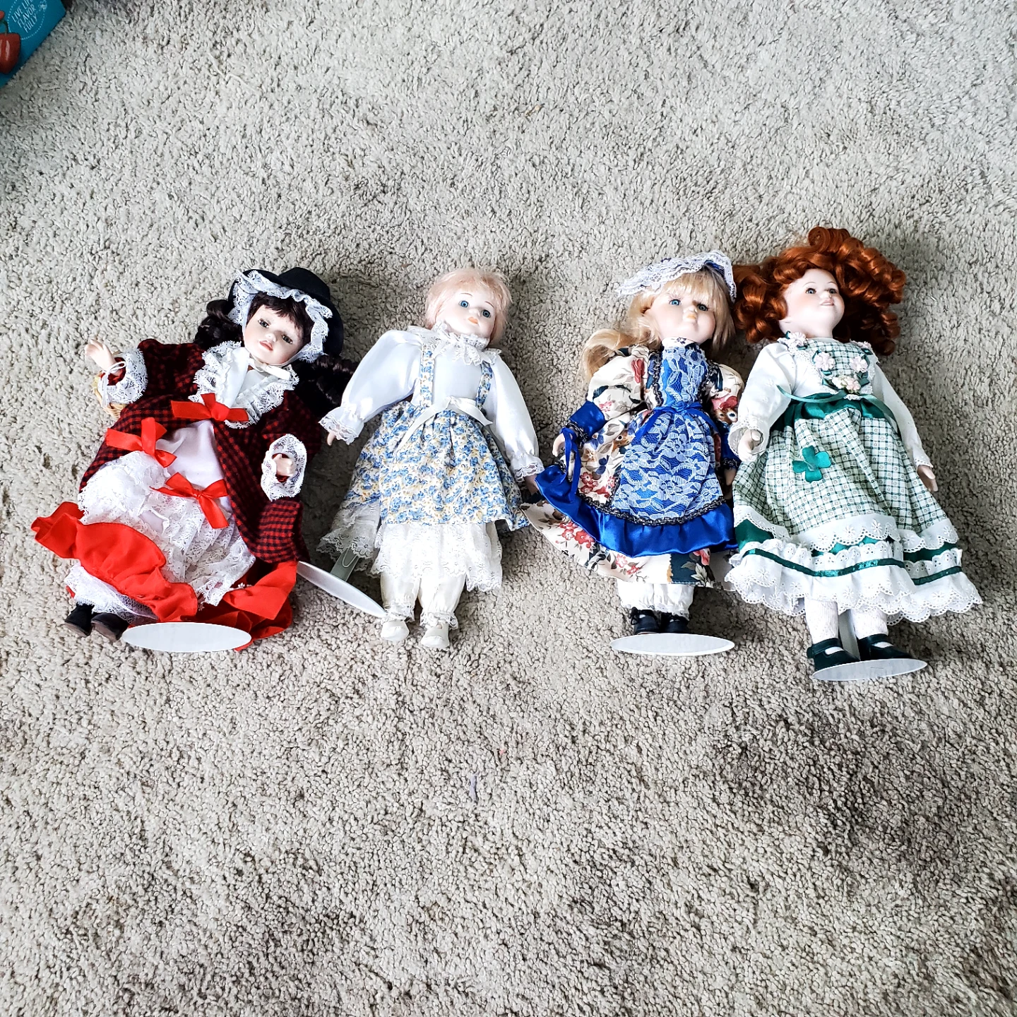 Collection of 4 Porcelain Dolls