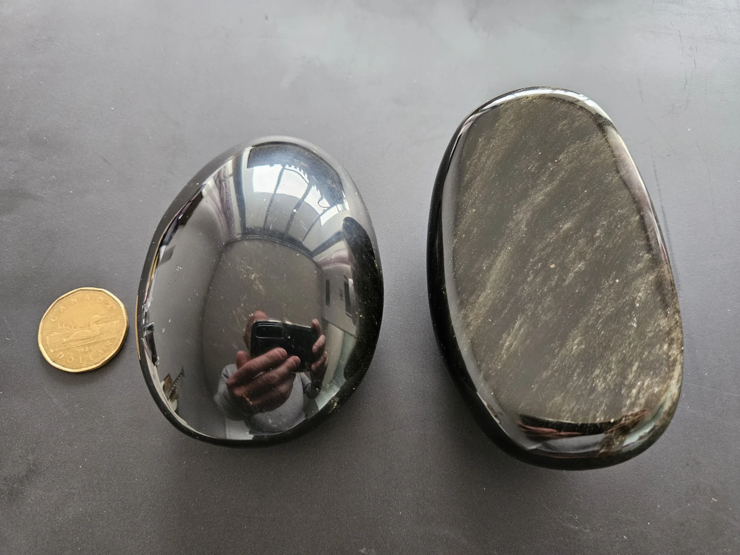 Black obsidian palm stone