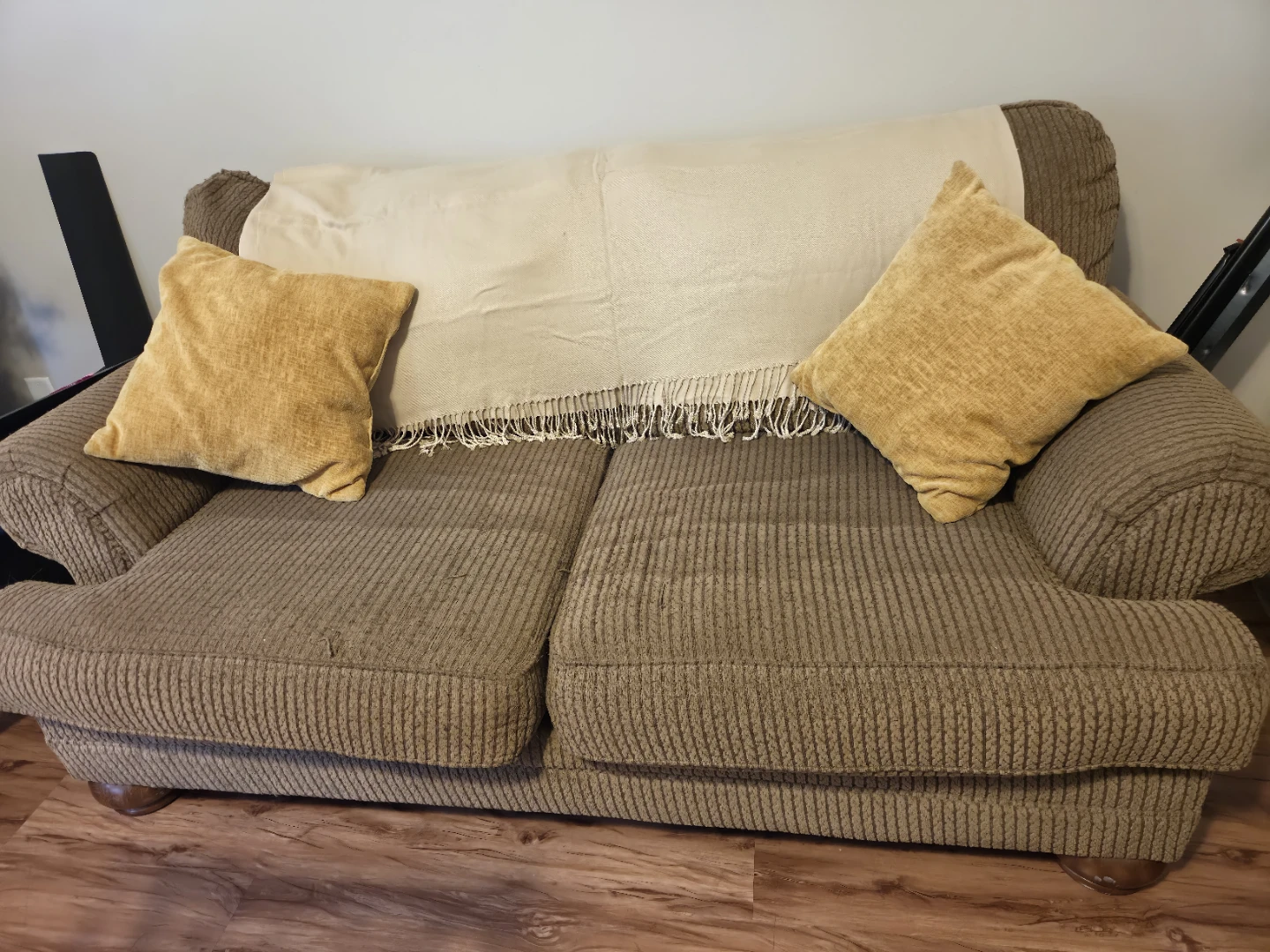Brown Sofa with Throw Pillows and Blanket