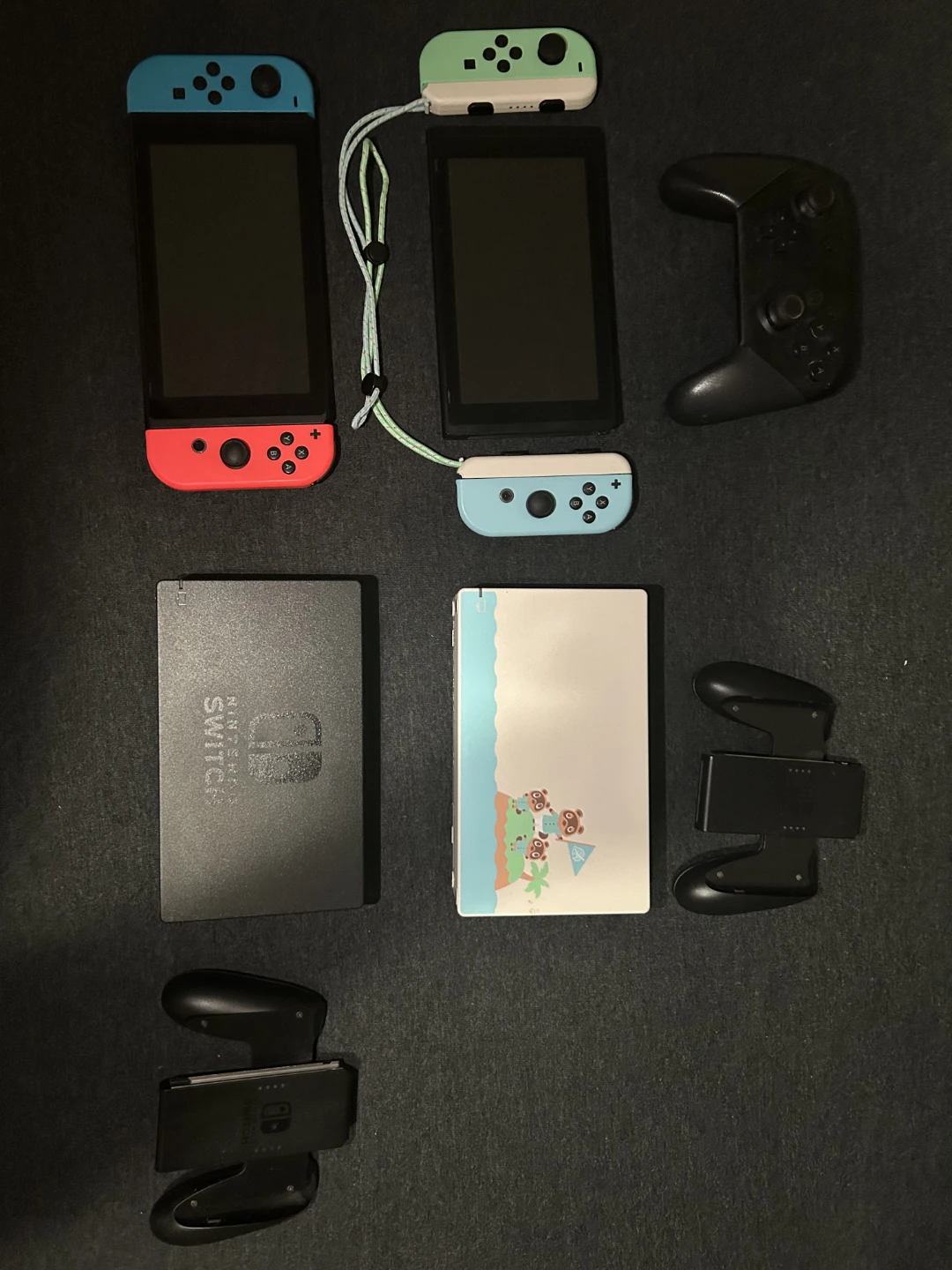 2 Nintendo Switches, 7 games, and case with controllers. - photo 2