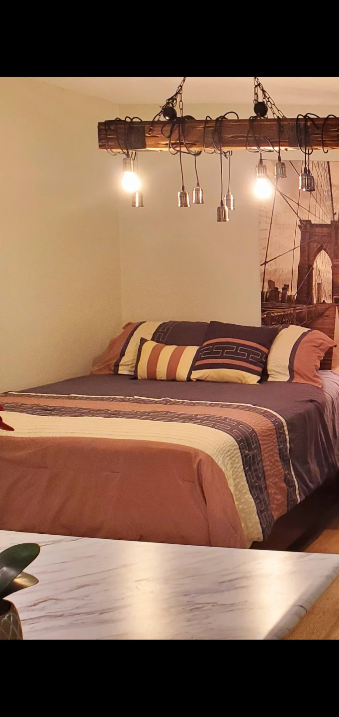 Beige and grey Queen comforter set.