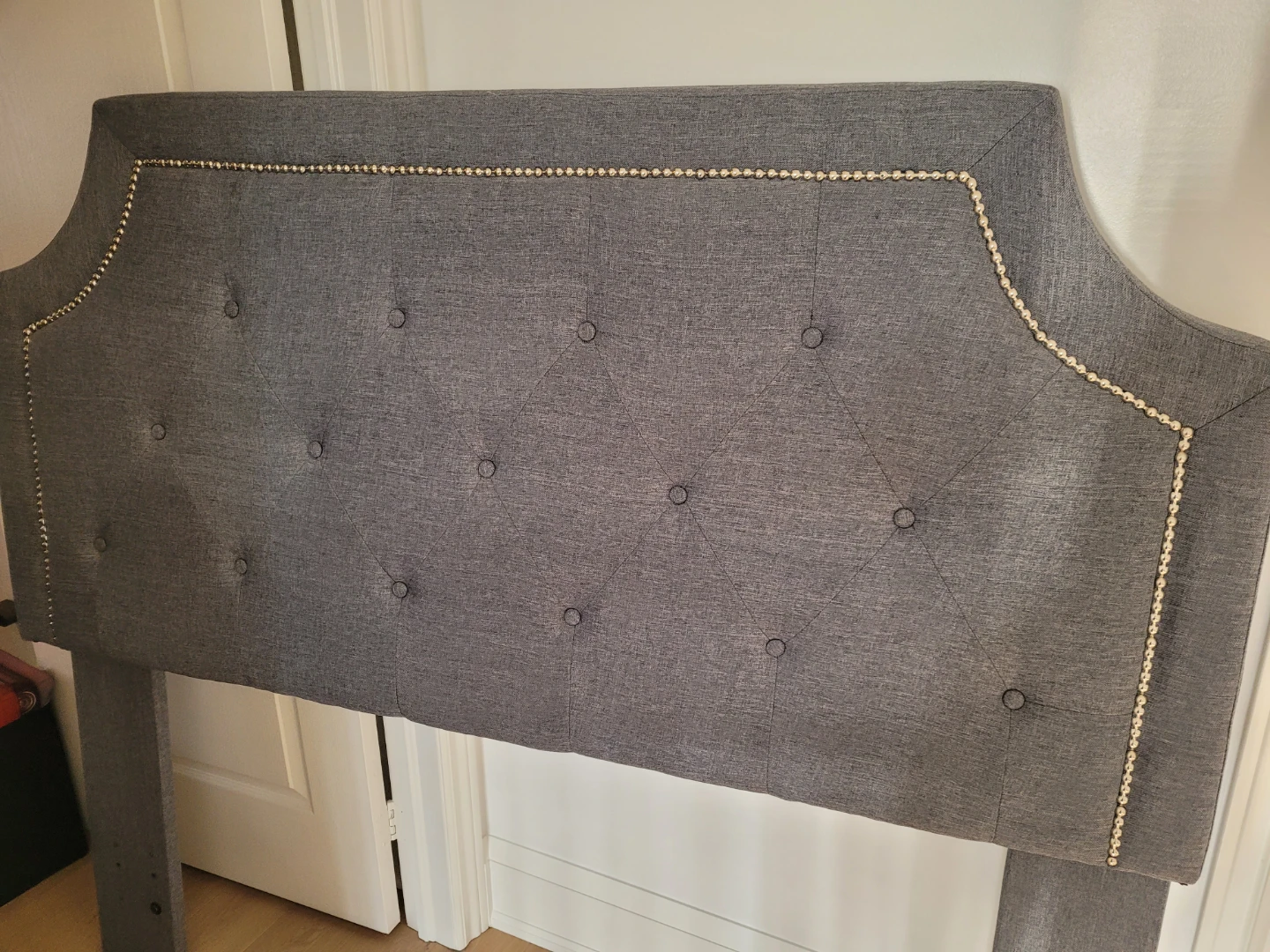 Grey Tufted Headboard with Nailhead Trim
