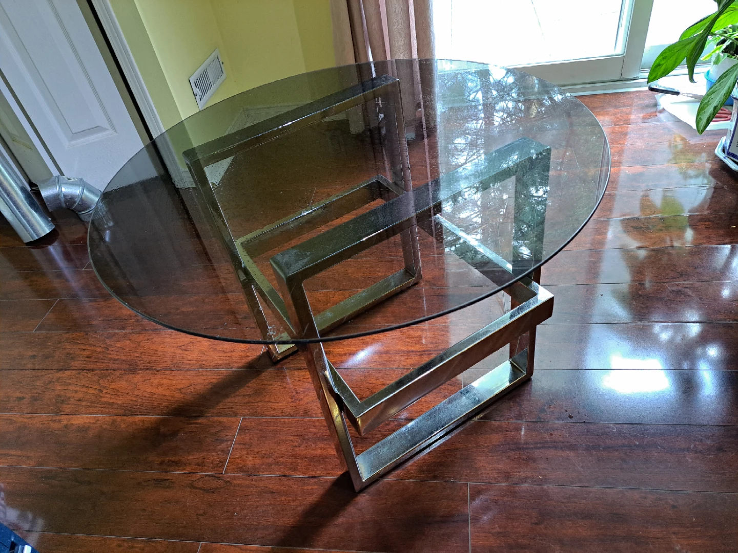 Glass top coffee table with metal frame