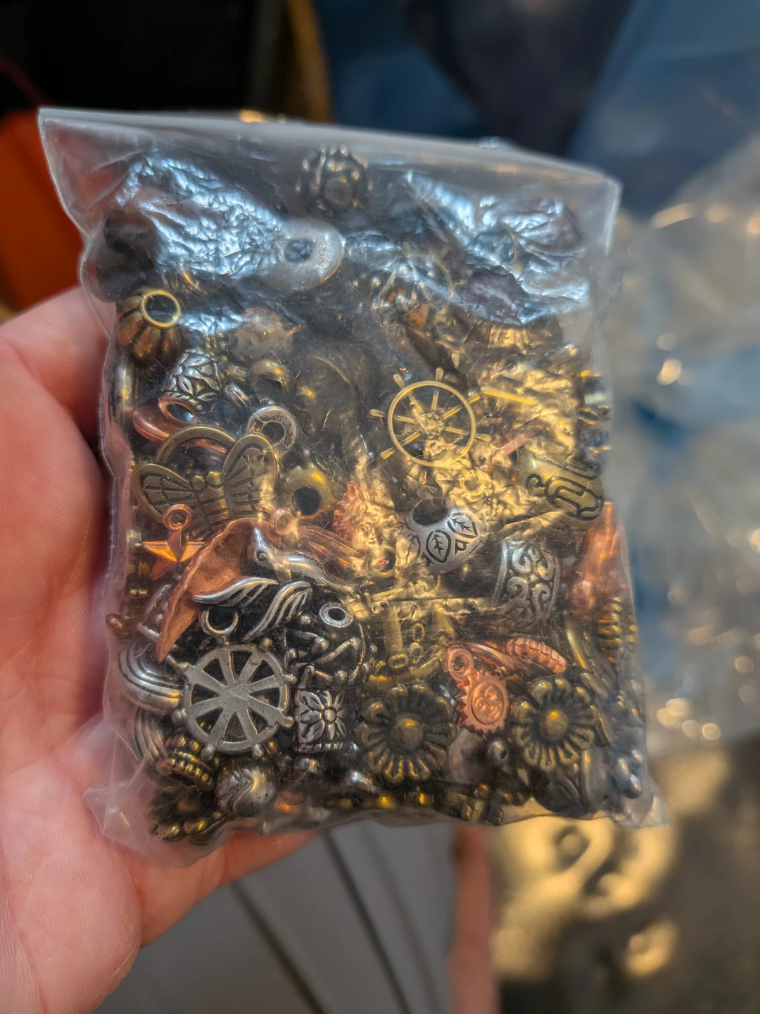 Small plastic anchors, steering wheels, flowers, other shapes