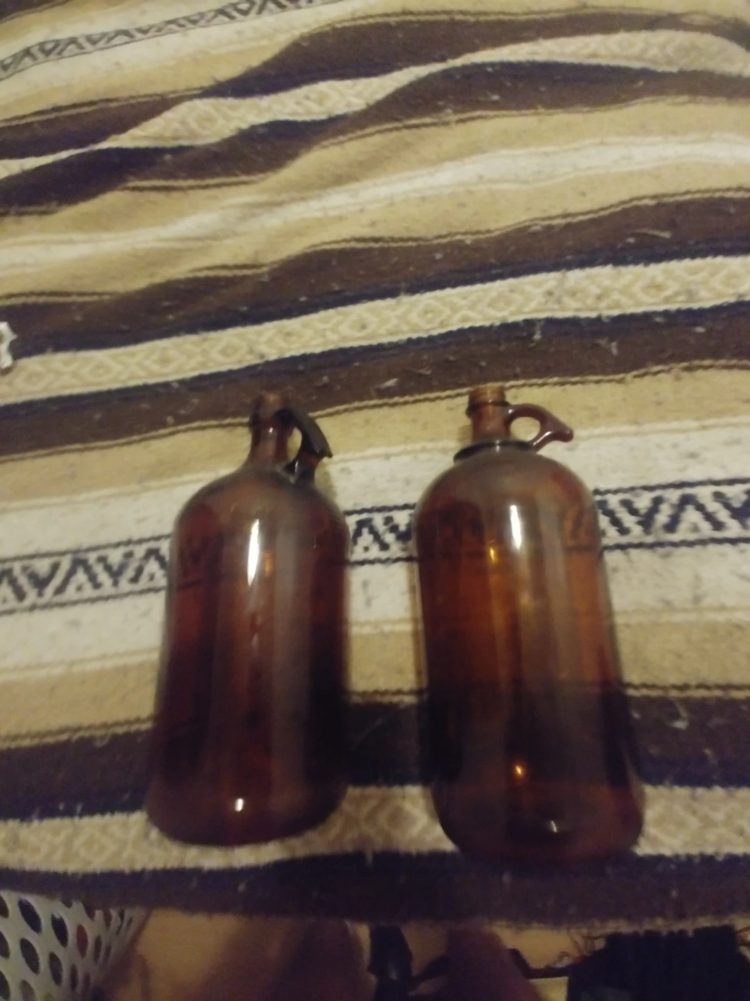 Two Brown Glass Jugs and Leather Canteen