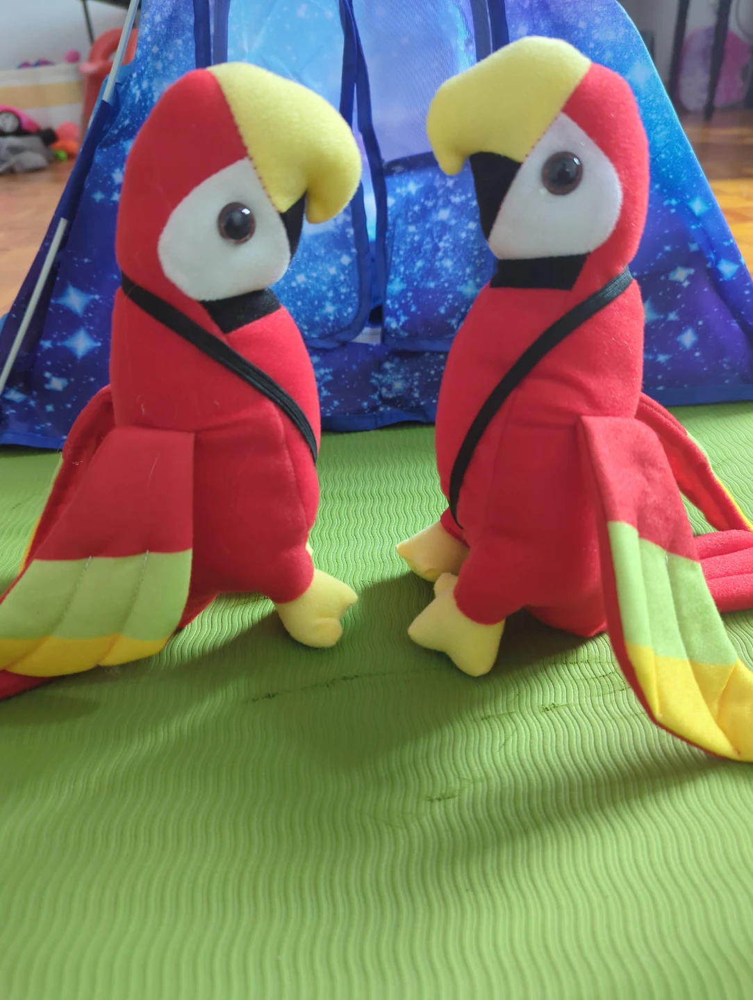 Two stuffed parrots