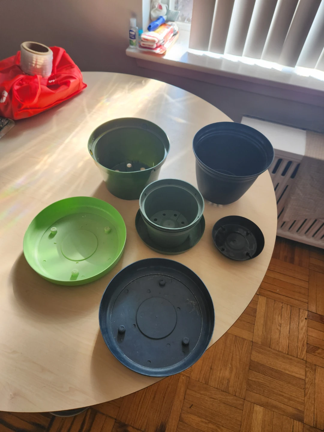 Assorted Plastic Plant Pots and Saucers