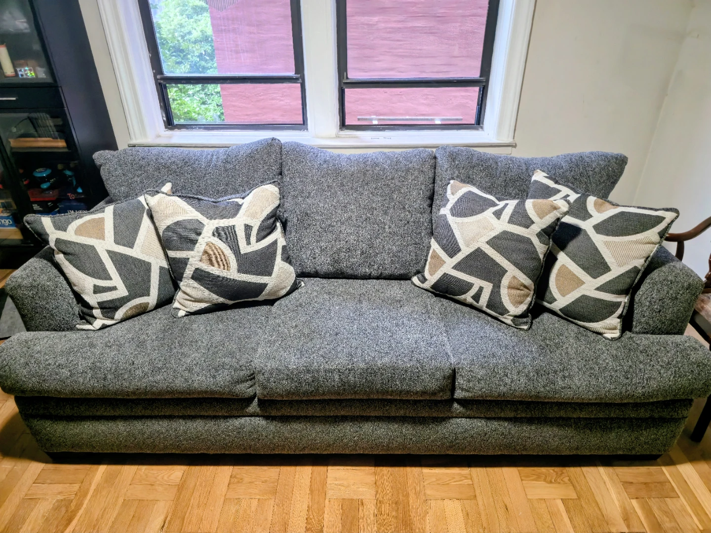 Gray Sofa with Geometric Pattern Throw Pillows