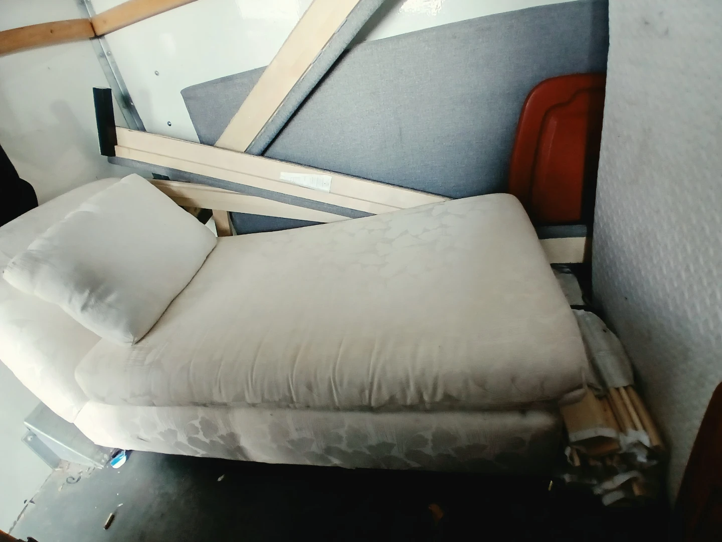 Cream upholstered chaise lounge with patterned fabric
