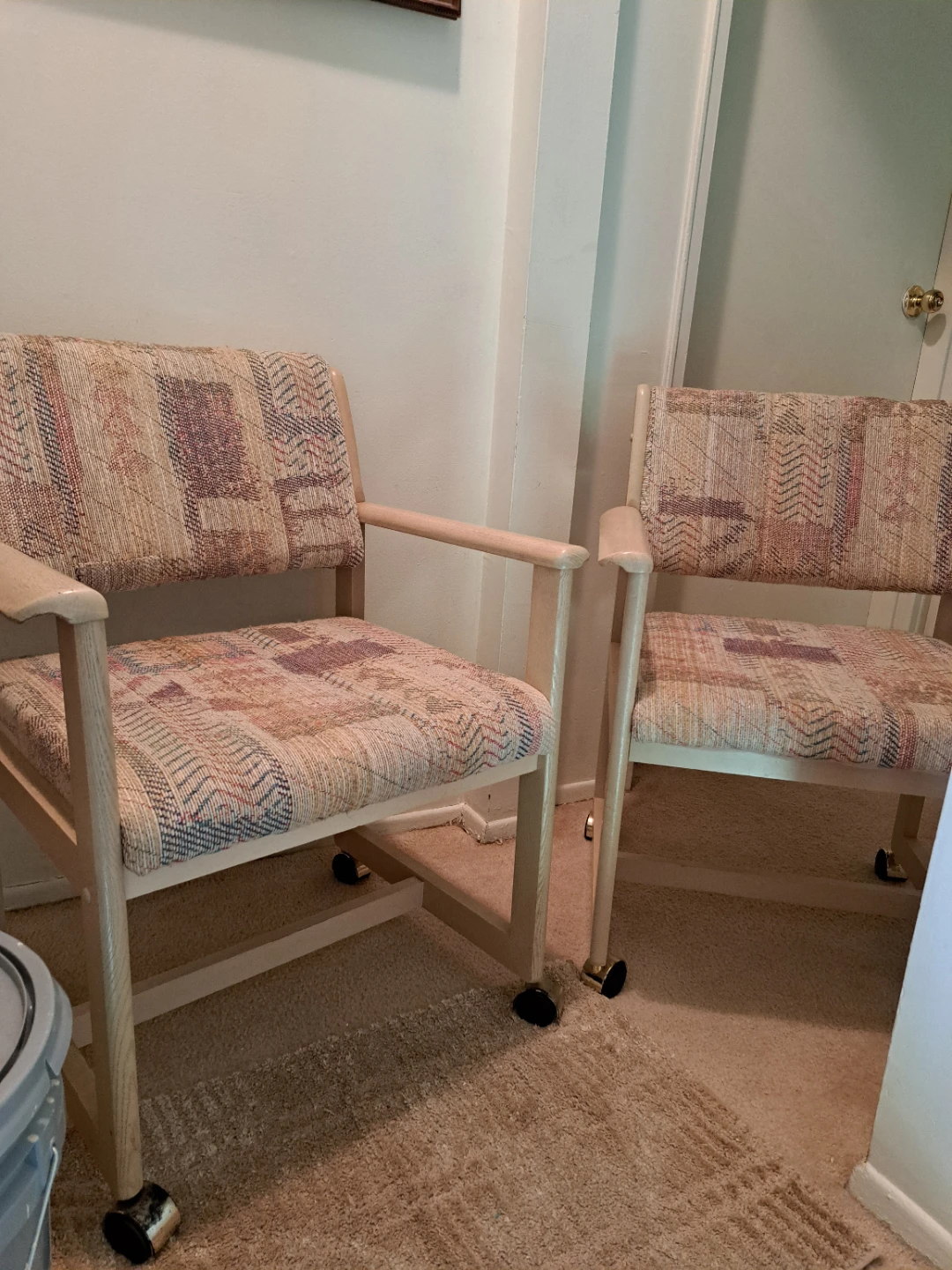 Two Upholstered Chairs with Wheels