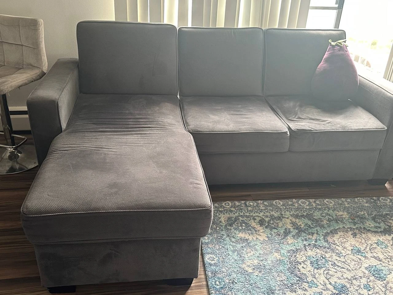 Grey sectional sofa with left facing chaise