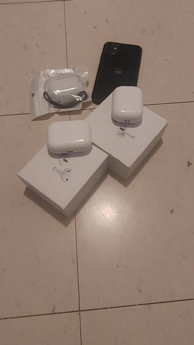 Two air pods pro with caseand a broken iPhone 11