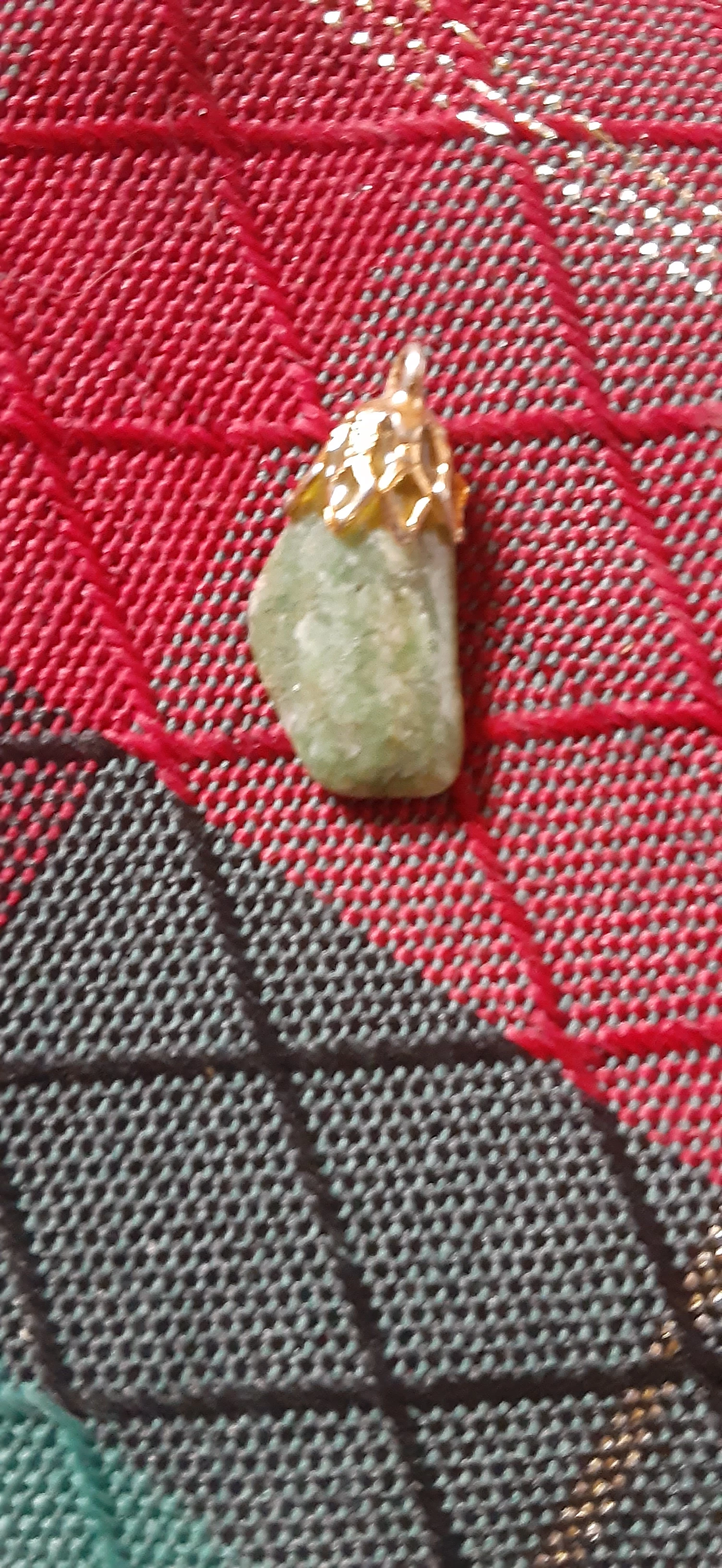 Green jade and laughing buddha jade pendants