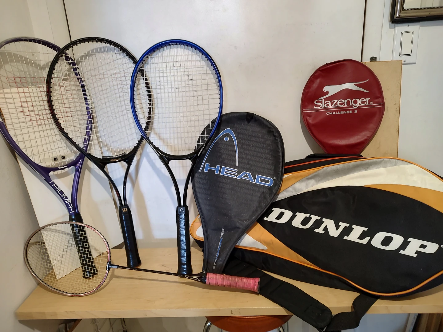 Two Wilson, one Head tennis racquets, Slazenger badminton Racket