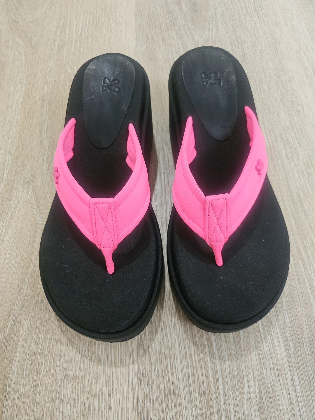 Black and pink wedge flip flops