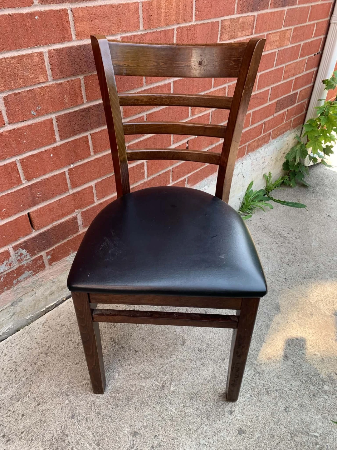 Wooden dining chair with black seat