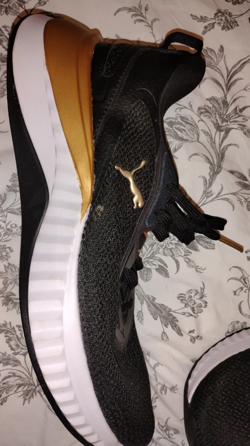 Puma Softride running shoes in black and gold