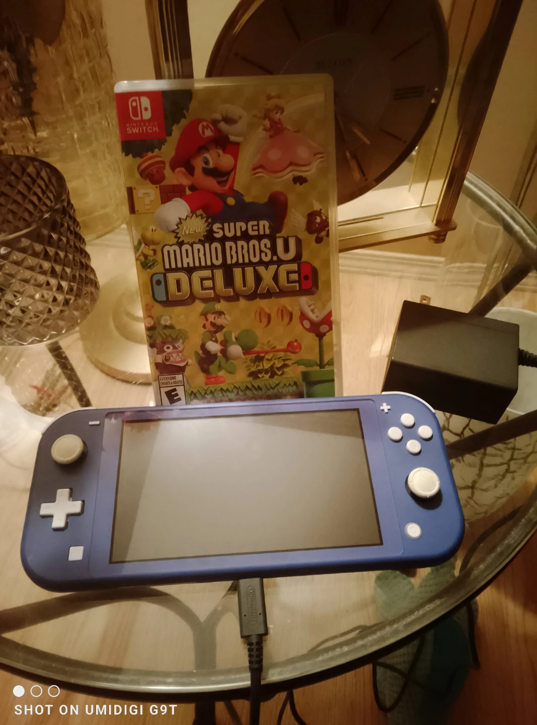 Nintendo switch lite with Mario Bros deluxe game