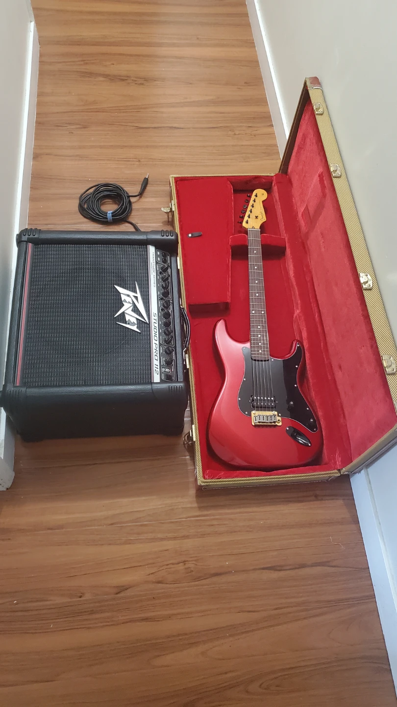 Peavey Studio Pro 112 Guitar Amplifier with Red Electric Guitar