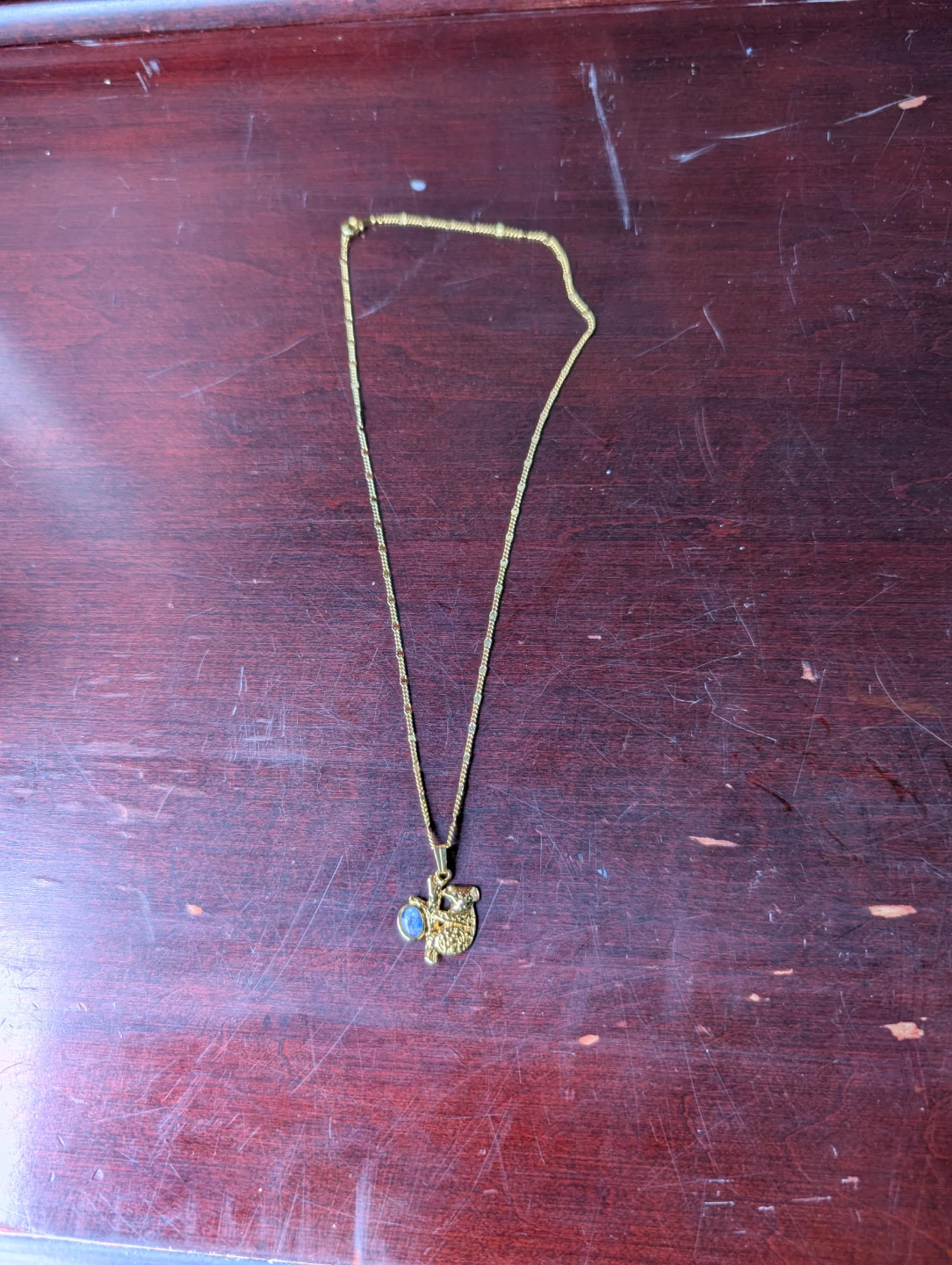 Gold toned Koala Necklace with Blue Stone