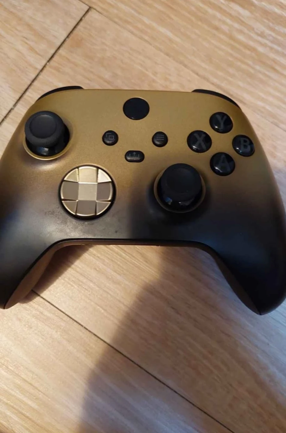 Gold and Black xbox controller