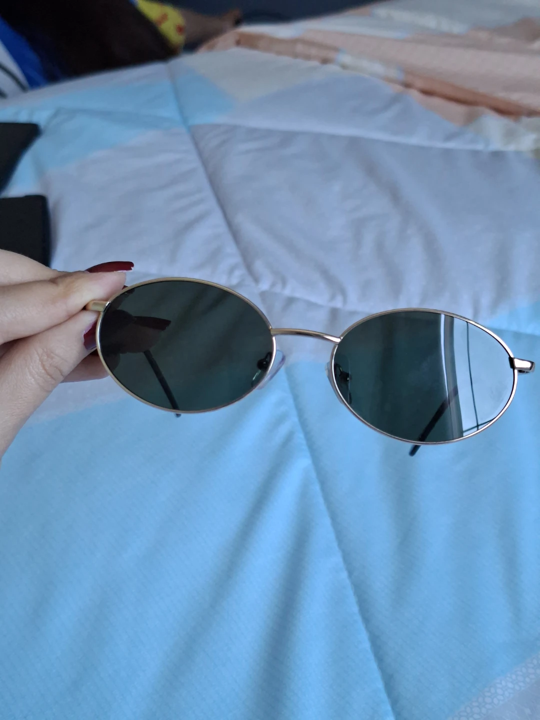 Gold frame oval sunglasses