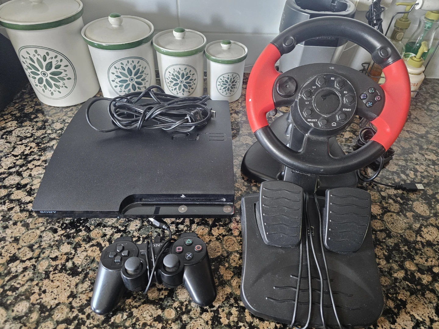 Sony PlayStation 3 (PS3) with Racing Wheel and Controllers