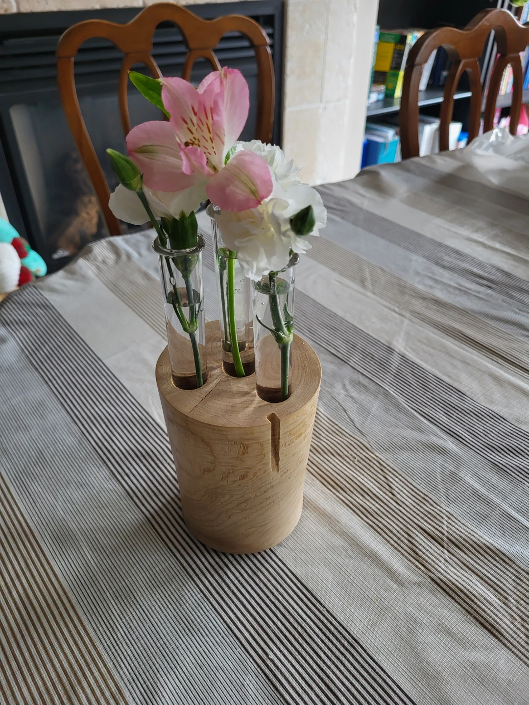 Natural wood bud vase with three plastic tubes