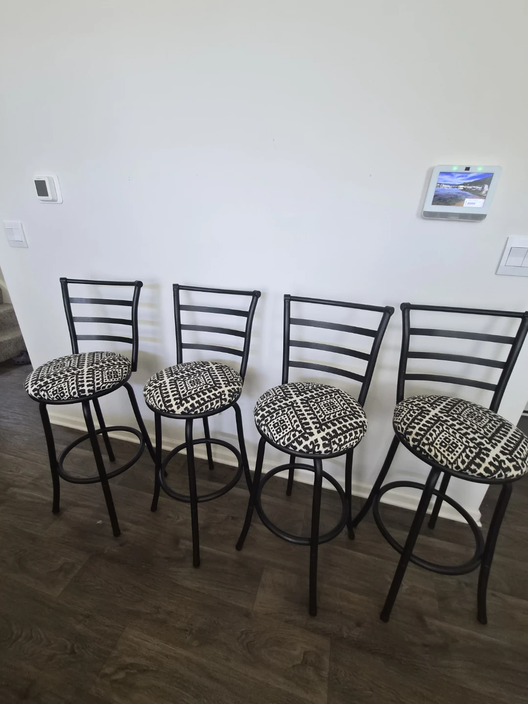 Set of 4 metal swivel bar stools with patterned cushions