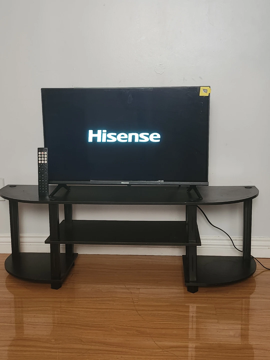Hisense TV and Black TV Stand
