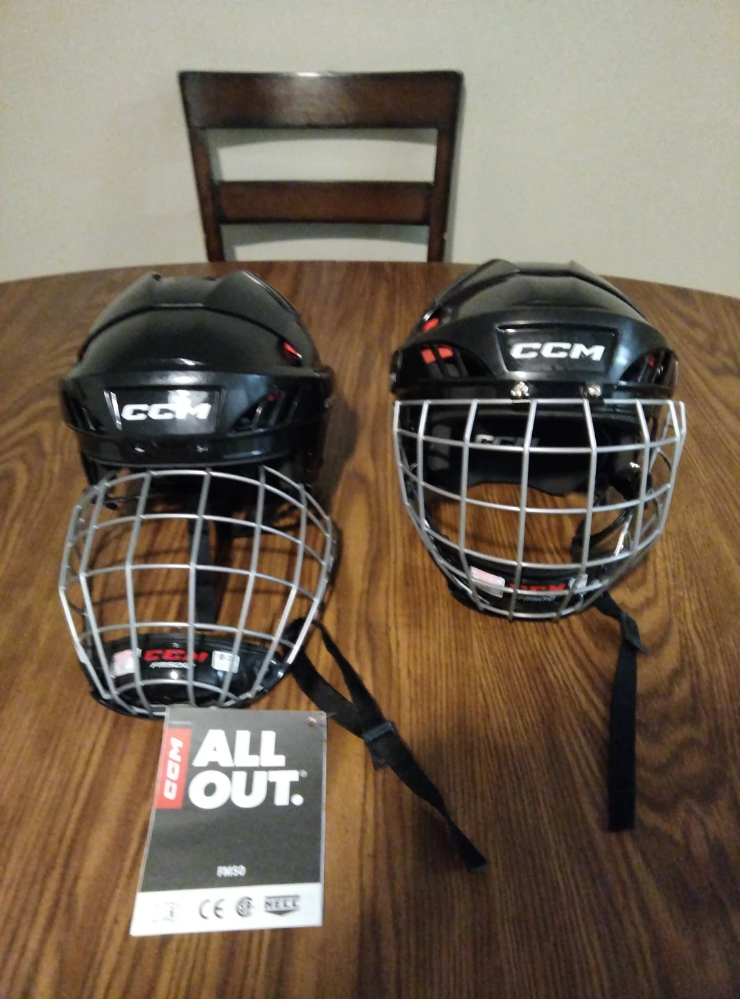 Two CCM Ice Hockey Helmets with Cages (2)