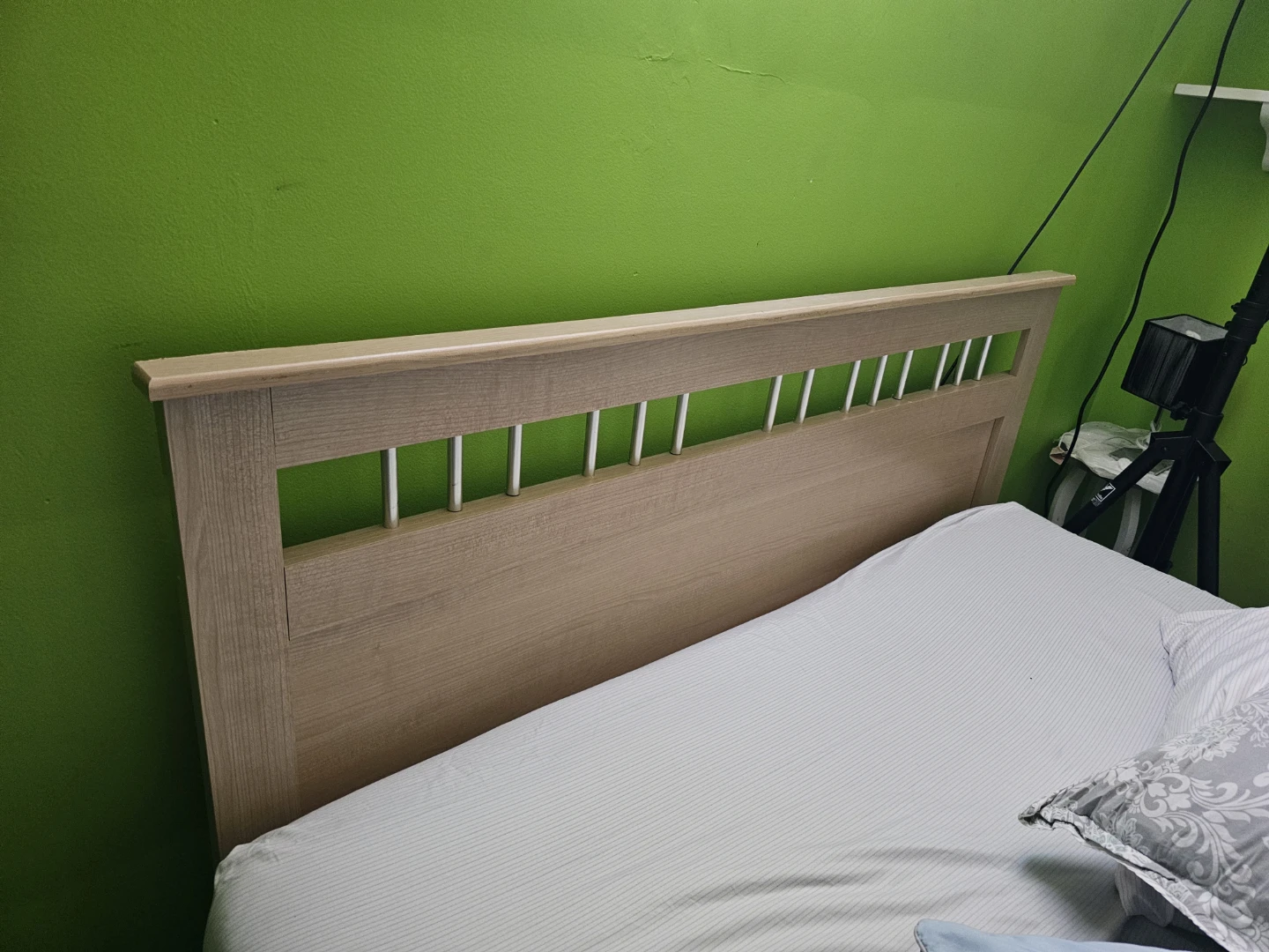 Light Wood Dresser with Mirror and a bed headboard
