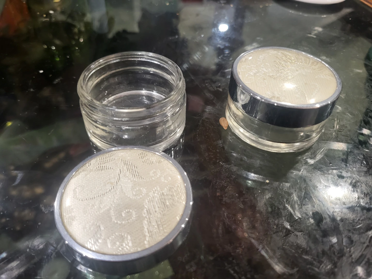 Pair of small glass jewelry boxes with lids