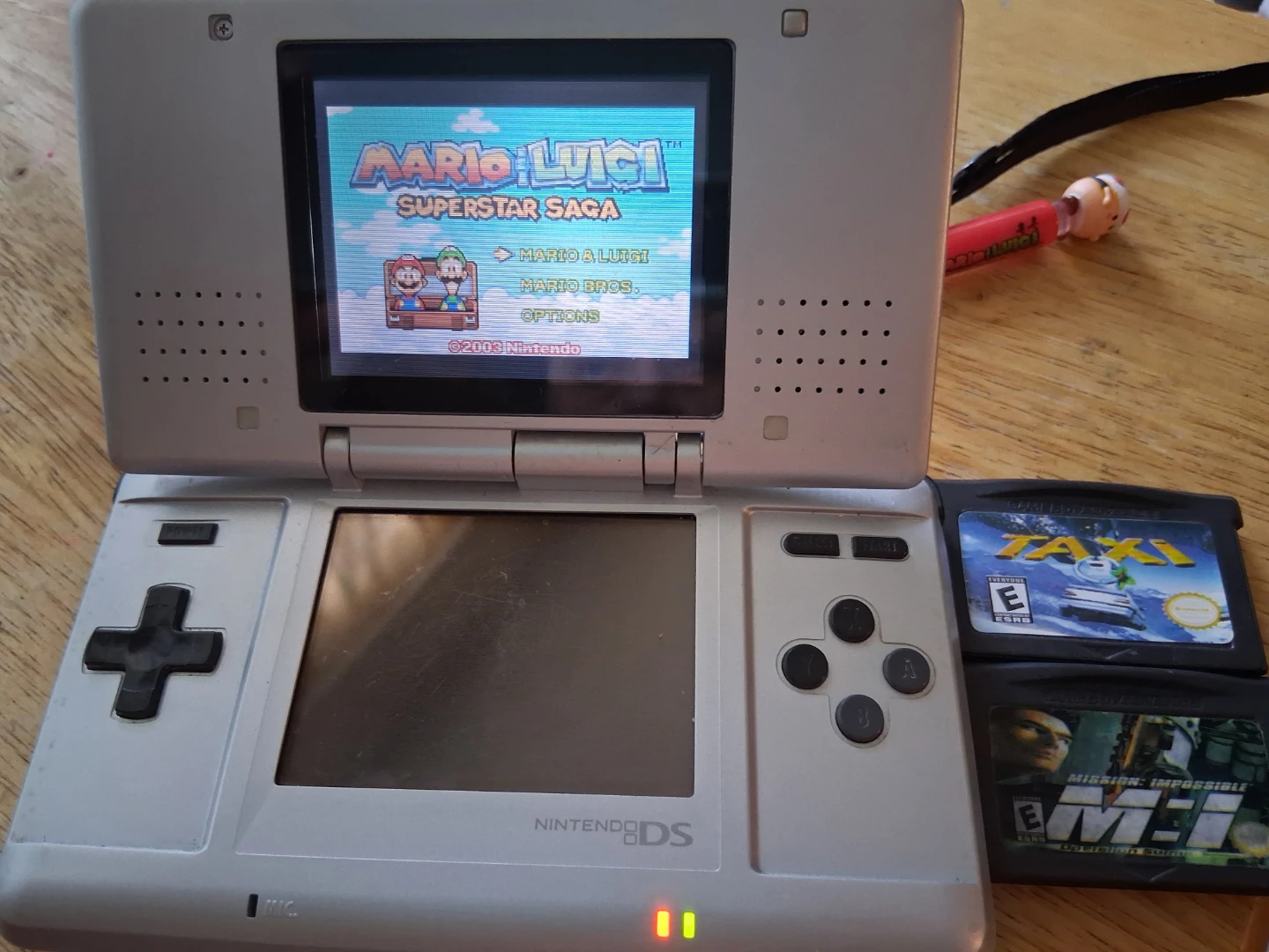 Phat Nintendo DS Silver + 4 game bundle - photo 2