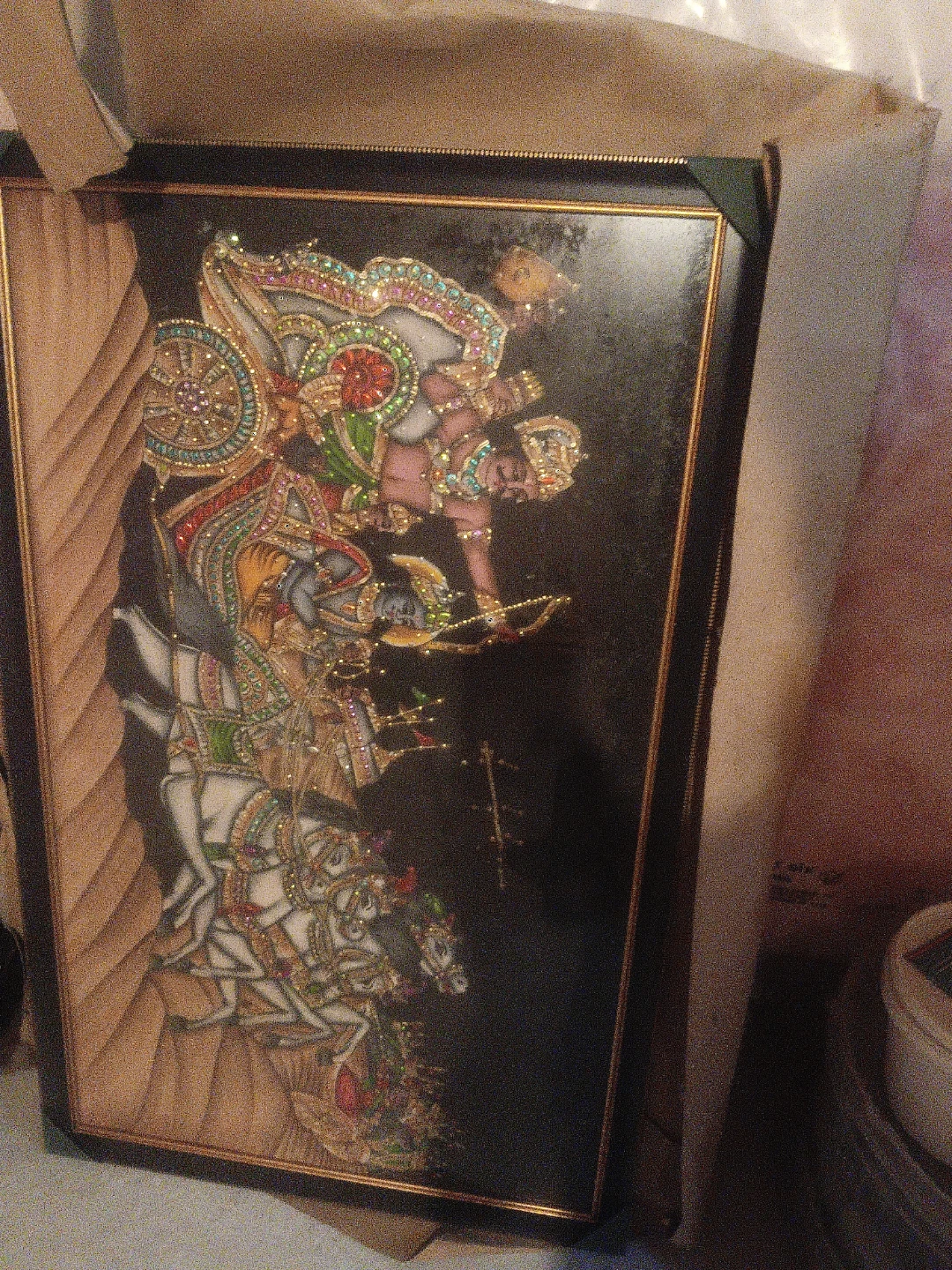 Framed Artwork Depicting a Traditional Scene