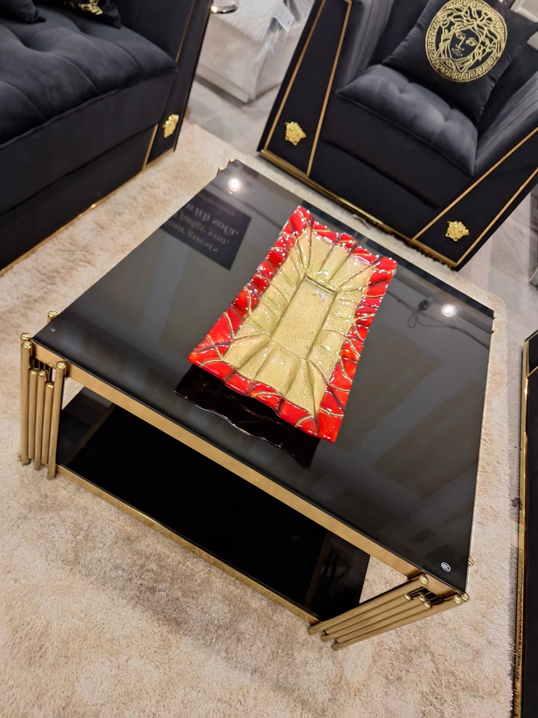 Black Glass Coffee Table with Gold Accents